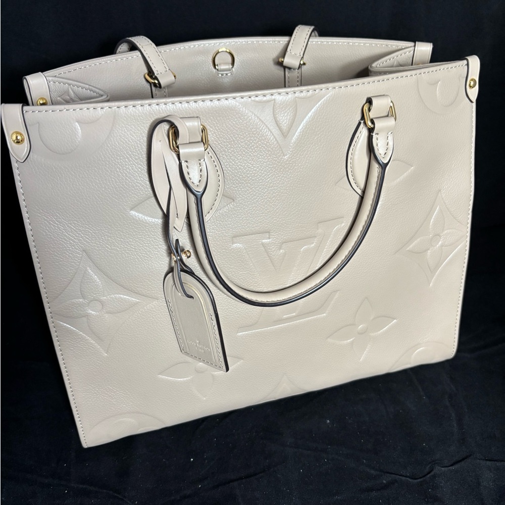 Louis Vuitton Beige Leather Tag